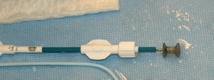 A nitinol device for closing muscular VSDs, 4 mm diameter in the centre. It is shown mounted on the catheter into which it will be withrawn during insertion.